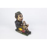 REPRODUCTION CAST IRON MECHANICAL MONEY BANK in the form of a seated Leprechaun and pig, 8" (20.3cm)