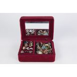 WINE RED VELVET JEWELLERY BOX WITH EMBOSSED EP APPLIED LID AND APPROXIMATELY 40 METAL COSTUME