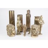 TWO BRASS SHELL CASES, A PAIR CAST BRASS BOOK-ENDS, A CAST BRASS STANDING LION, A PAIR OF MODERN