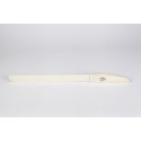 A EARLY 20TH CENTURY CARVED IVORY LETTER OPENER the handle with black stained engraved with