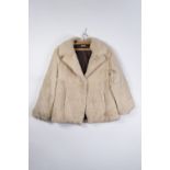 A LADIES BLACK FUR COAT, PETER PAN COLLAR, 4 large decorative buttons, 3/4 length, a ladies cream