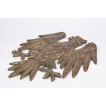 A CAST COPPER ALLOY APPLIQUE IN THE FORM OF AN HERALDIC DISPLAYED EAGLE, also a cast bronze wall