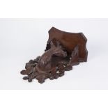 AN EARLY 20TH CENTURY BLACK FOREST CARVED LINDEN WOOD STAGS HEAD WALL BRACKET
