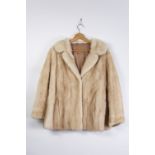 A PASTEL MINK COAT FOLD OVER COLLAR, 2 hook eye fastenings, hip length, hidden front pockets, silk