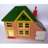 20th CENTURY PAITNED WOODEN DOLLS HOUSE WITH GARAGE, printed paper brickwork and green painted roof,