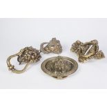 FOUR 20TH CENTURY CAST BRASS LION MASK AND OTHER DOOR KNOCKERS