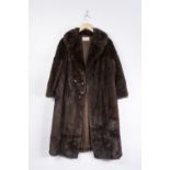 A LADIES DARK BROWN MINK COAT FOLD OVER COLLAR, four decorative buttons, 3/4 length, hidden front