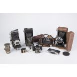 THREE FOLDING POCKET CAMERAS, COMPRISING, KERSHAW CURLEW III 'Coronet' RAPIDE (both in case) and a