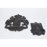 A LATE 19TH CENTURY/EARLY 20TH CENTURY CAST IRON ARMORIAL OPENWORK APPLIQUE, 12" (30.5 cm) high,