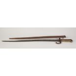 NINETEENTH CENTURY FRENCH SWORD BAYONET, of typical form with ribbed brass grip, down carved