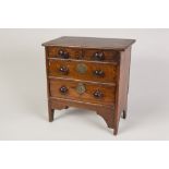 LATE NINETEENTH CENTURY OAK MINIATURE CHEST APPRENTICE PIECE, having two short over two long