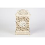 A LATE NINETEENTH CENTURY CHINESE CANTON EXQUISITELY CARVED AND PIERCED IVORY CASED MANTEL CLOCK/