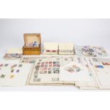 STAMPS - TWO PART ALBUMS OF ALL WORLD STAMPS, a SMALL TIN OF MINT BRITISH STAMPS, two small tins and