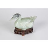 A PAIR OF CHINESE CELADON JADE covered boxes in the form of Mandarin ducks, with black inclusions,
