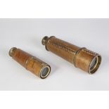 TWO ELLIOTT BROTHERS THREE DRAW BRASS TELESCOPES, covered in brown hide, 18 1/4" (46.4cm) and 16" (