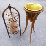 CIRCA 1920's INLAID MAHOGANY JARDINIERE STAND, RAISED ON SCROLL SUPPORTS AND HOUSING A BRASS PLANTER