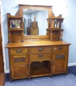 ART NOUVEAU STYLE OAK SIDEBOARD, THE BACK FITTED WITH BEVELLED MIRROR FLANKED BY SMALL BEVELLED