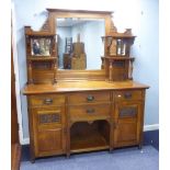 ART NOUVEAU STYLE OAK SIDEBOARD, THE BACK FITTED WITH BEVELLED MIRROR FLANKED BY SMALL BEVELLED