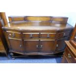 AN OAK SIDEBOARD WITH SLIGHT DOUBLE RETURN SHAPED FRONT, LOW BACK FITTED WITH TWO SHALLOW ANGLED