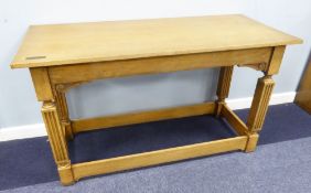 A LIGHT OAK REFECTORY TABLE, 4'6" X 2', ON FLUTED SQUARE SUPPORTS WITH STRETCHERS, INSET WITH A