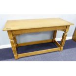 A LIGHT OAK REFECTORY TABLE, 4'6" X 2', ON FLUTED SQUARE SUPPORTS WITH STRETCHERS, INSET WITH A