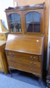 SHERATON REVIVAL STYLE MAHOGANY BUREAU-BOOKCASE WITH LOW SUPERSTRUCTURE CABINET HAVING DWARF BACK