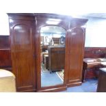 VICTORIAN MAHOGANY BREAKFRONT WARDROBE WITH QUADRANT FORECORNERS AND MOULD CORNICE, THE CENTRAL