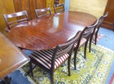 A REPRODUCTION REGENCY STYLE MAHOGANY TWO PILLAR DINING TABLE WITH D END TOP, 4'9" X 3', HAVING