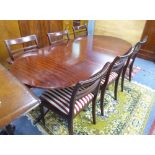 A REPRODUCTION REGENCY STYLE MAHOGANY TWO PILLAR DINING TABLE WITH D END TOP, 4'9" X 3', HAVING