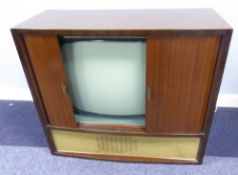 BUSH TELEVISION RECEIVER IN WALNUT BOW-FRONTED CONSOLE CABINET WITH TAMBOUR SHUTTERS