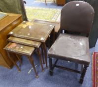 AN OAK DINING CHAIR WITH PADDED DOME PANEL BACK AND STUFFED OVER SEAT WITH UPHOLSTERY IN BROWN