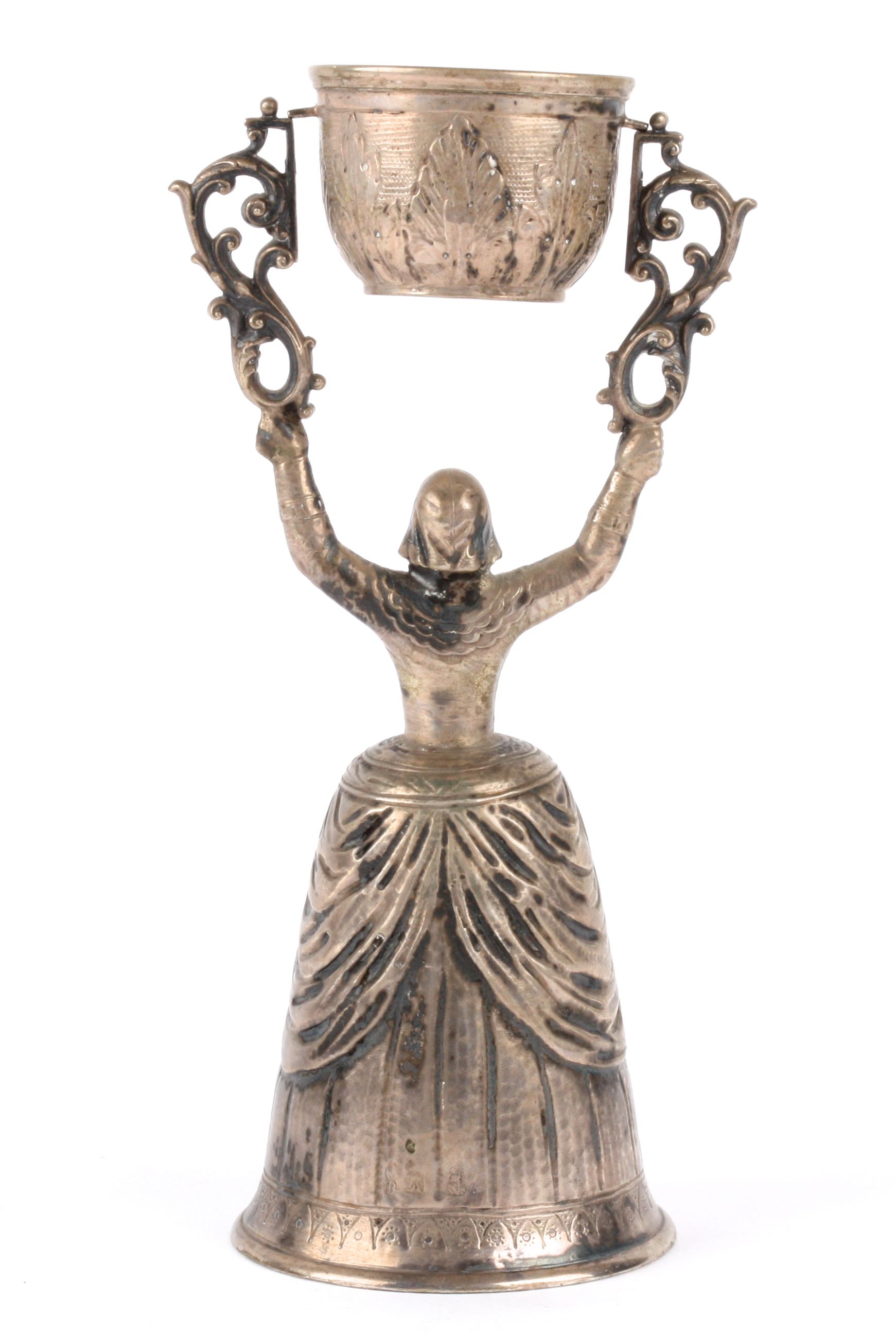 A Continental silver wager cup, 19th century modelled as a maiden standing with her arms above her - Image 2 of 2