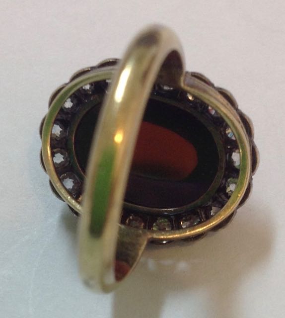 An Early Victorian cabochon garnet and diamond set oval cluster ring the large central garnet set - Image 4 of 6