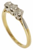 A three stone diamond set ring with platinum and 18ct gold mount, approximate total diamonds 0.45