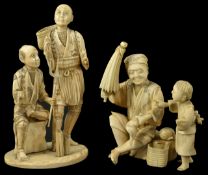 Two sectional Walrus Ivory Groups, late 19th century a father seated holding a shell and umbrella