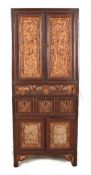 An Oriental hardwood cabinet, 20th century of small proportions and rectangular form with two glazed