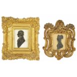 A 19th century silhouette miniature portrait of a Gentleman signed to reverse Capt. Hollamby, in a