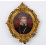 An late 18th century oval enamel on copper portrait of a young gentleman, possibly Lord Melbourne,