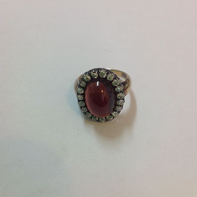 An Early Victorian cabochon garnet and diamond set oval cluster ring the large central garnet set - Image 6 of 6