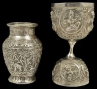 An Indian silver double ended cup late 19th /early 20th century, with repousse decoration of deities