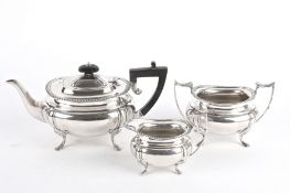 A George V three piece silver tea service, Sheffield 1924 comprising of a teapot, twin handled sugar