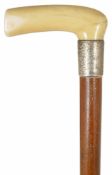 A late 19th century ivory handled and malacca walking stick with simple ivory handle and silver