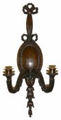 An Adamesque mahogany wall twin branch candle sconce, 19th century the ribbon carved mount above