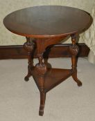 A mahogany circular side table, 19th century with three turned wrythen splayed supports united by