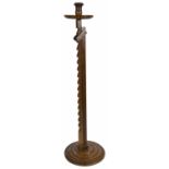 A mahogany adjustable ratchet candlestick, 20th century the tulip shaped candle stick upon
