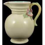 A Clarice Cliff cream ground jug, the ribbed neck above a bulbous body with circular foot ring and
