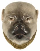 A porcelain bonbonniere or snuff box, possibly Meissen modelled as a head of a pug dog, his fur