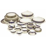 A Royal Worcester Regency pattern tea/dinner service with blue and gilt banded decoration,