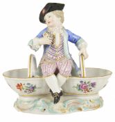 A Meissen porcelain figural basket salts, late 19th/early 20th century a young man seated