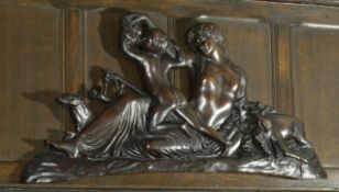 A mahogany carving of Diane the Huntress, late 19th century with Diane laying scantily clad with a